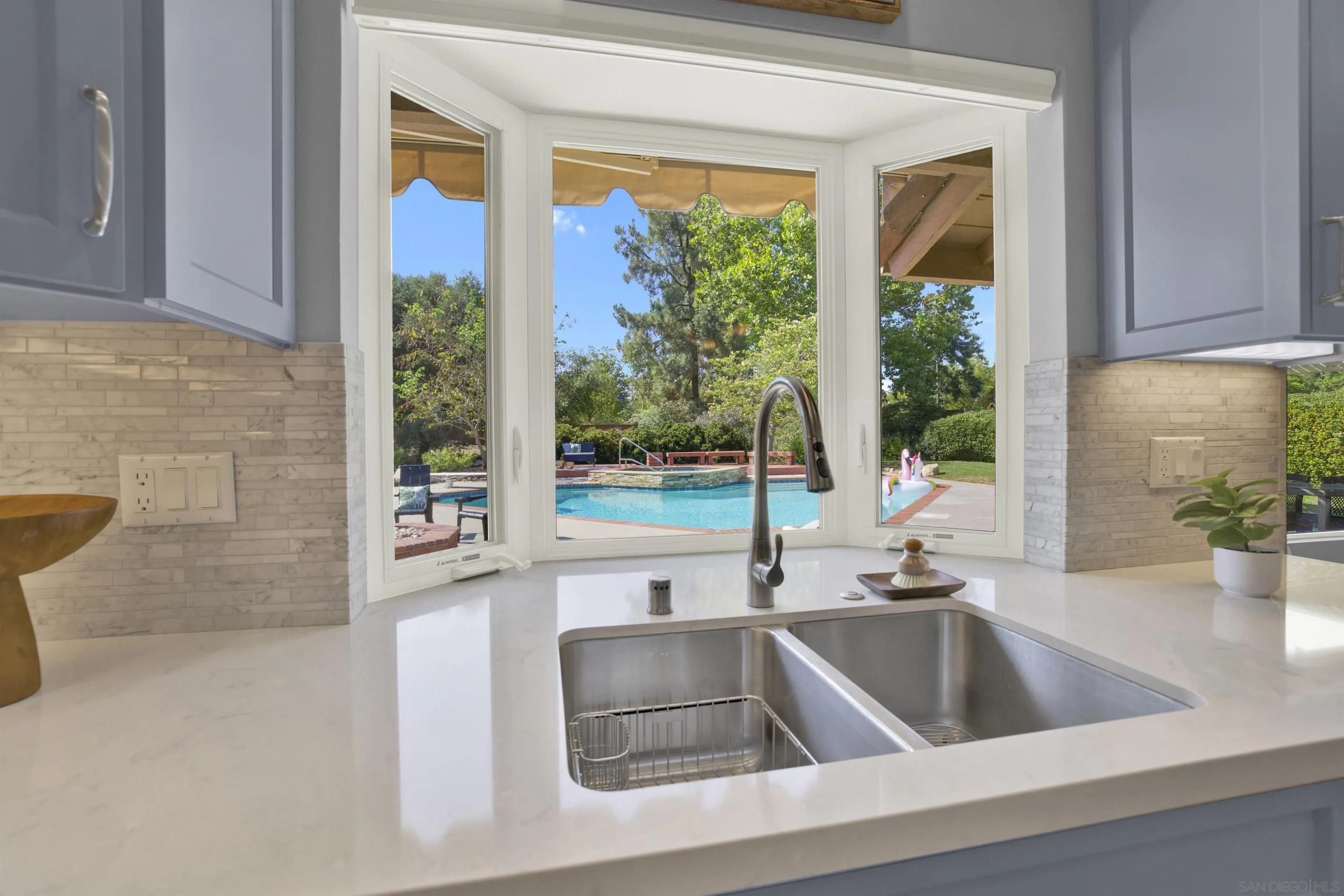 14012 Valley Springs Road Poway, CA 92064 - Photo 21 of 57 a kitchen with a sink and a large window