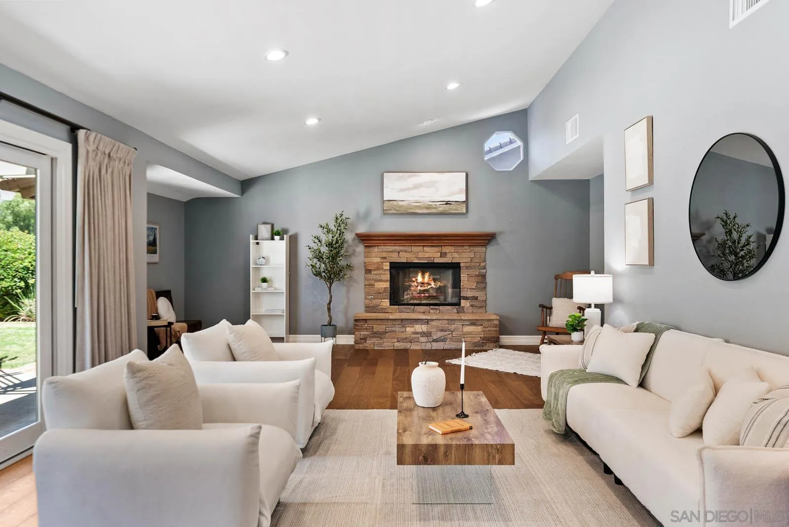 14012 Valley Springs Road Poway, CA 92064 - Photo 25 of 57 a living room with furniture a large window and a fireplace