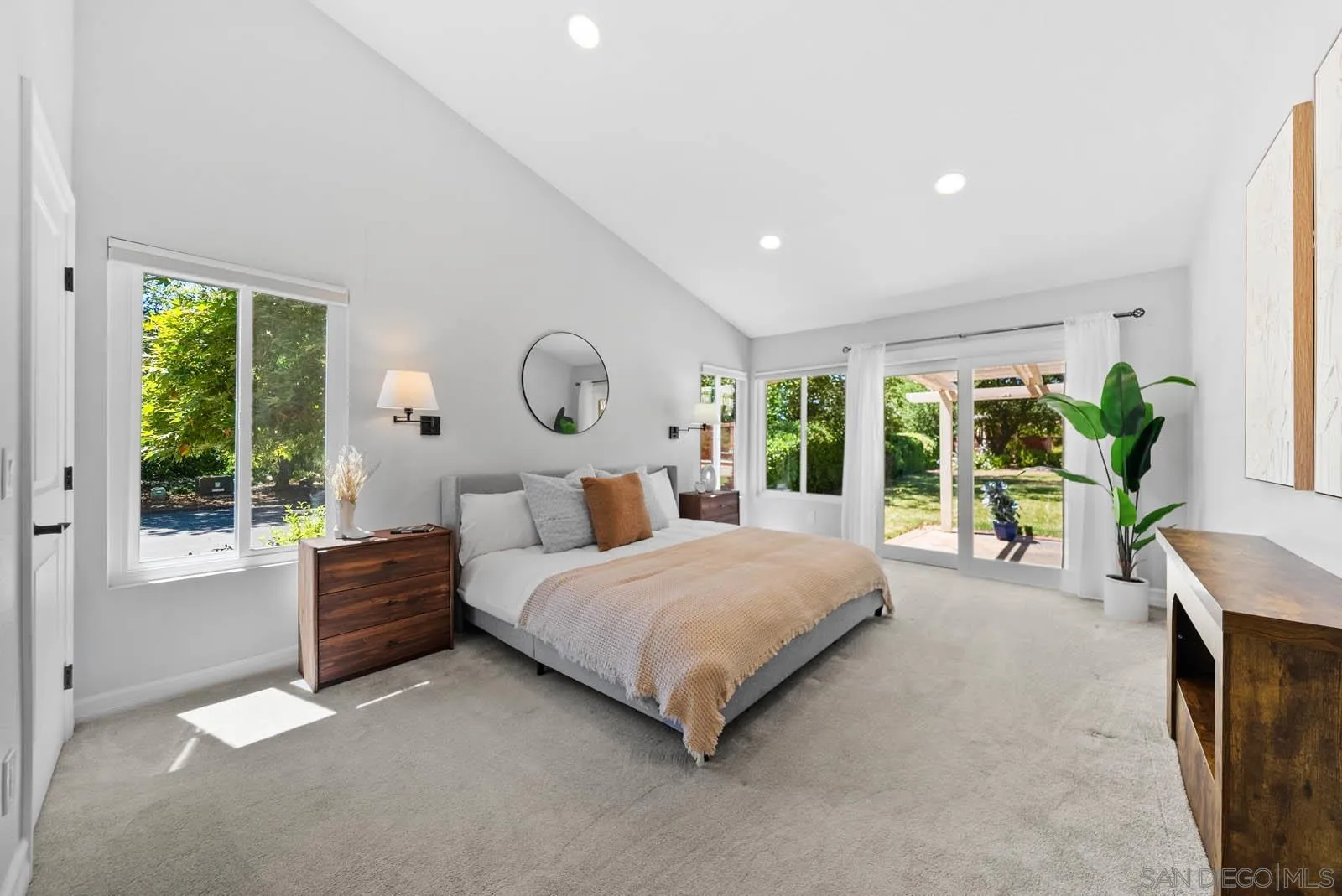 14012 Valley Springs Road Poway, CA 92064 - Photo 26 of 57 a bedroom with a bed and large windows