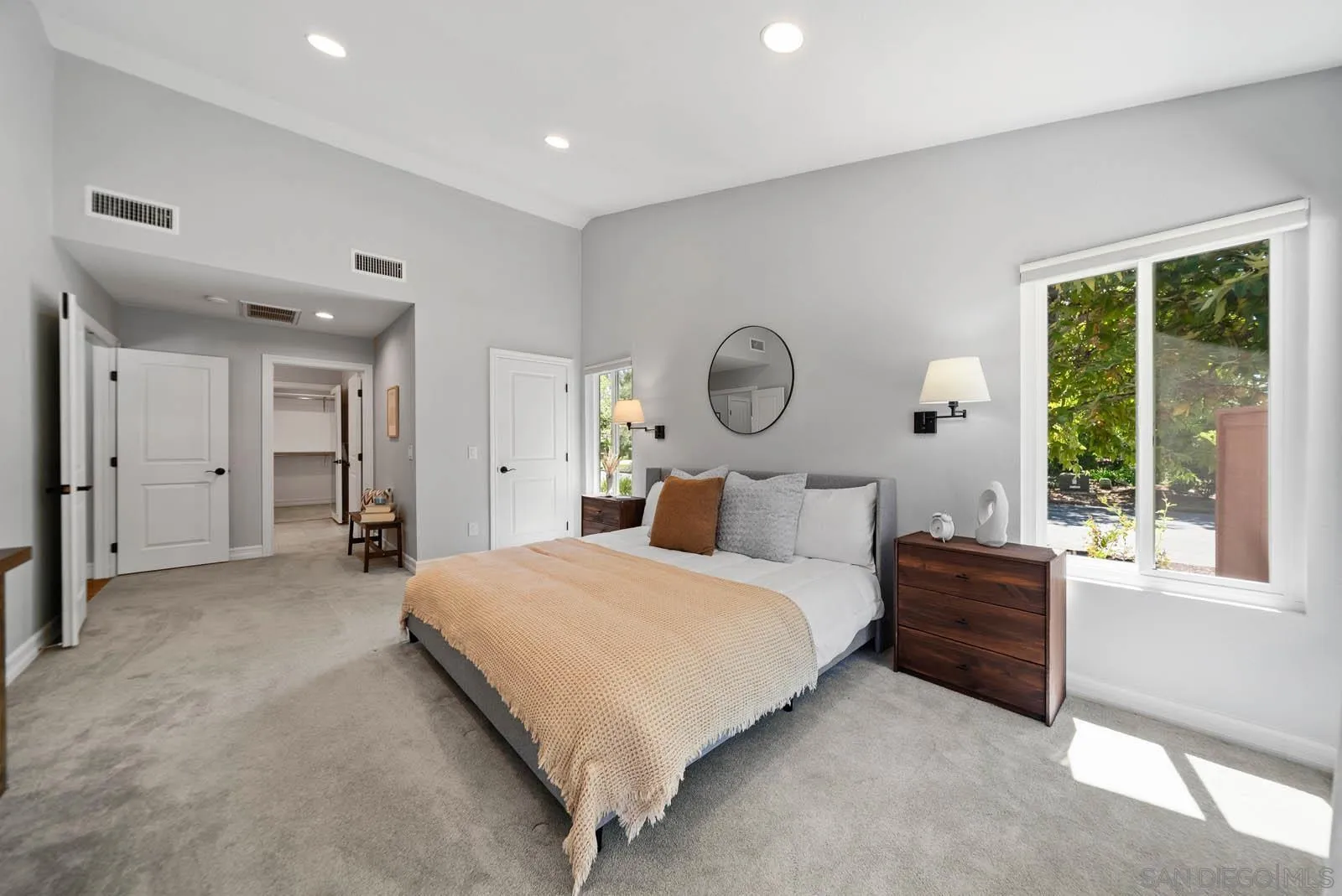 14012 Valley Springs Road Poway, CA 92064 - Photo 27 of 57 a bedroom with a large bed and windows