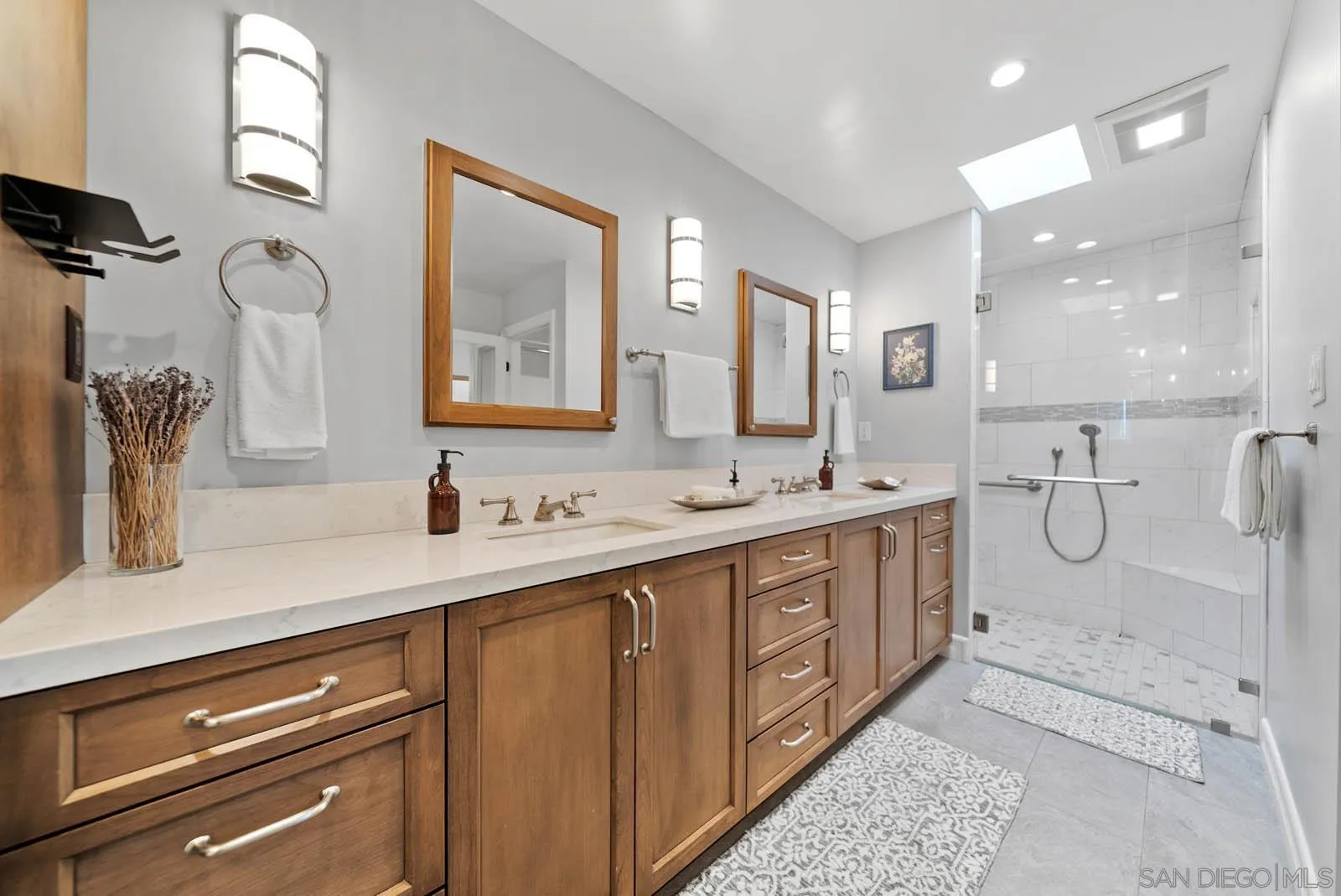 14012 Valley Springs Road Poway, CA 92064 - Photo 28 of 57 a bathroom with a double vanity sink mirror and shower