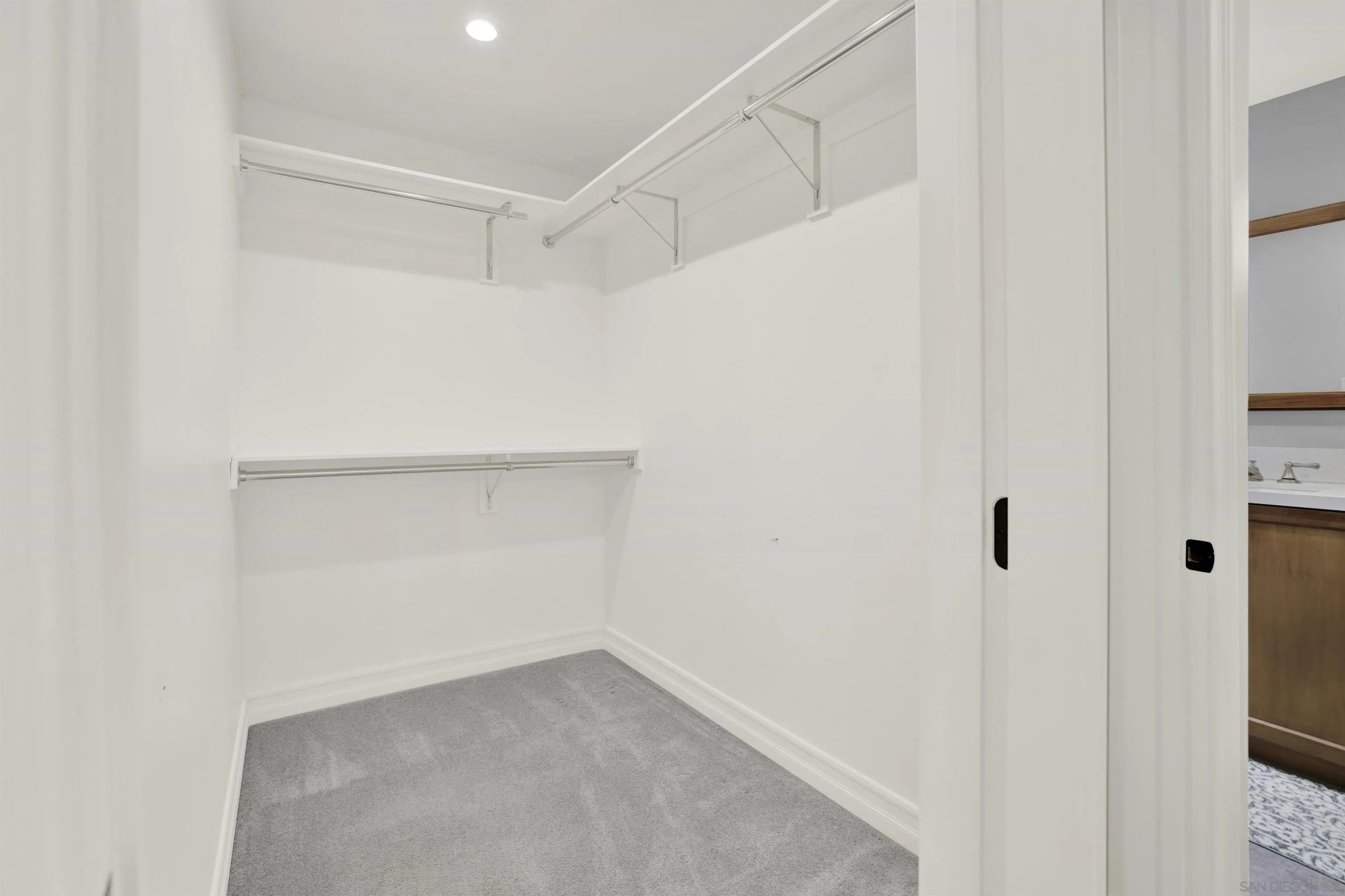 14012 Valley Springs Road Poway, CA 92064 - Photo 31 of 57 a view of an empty walk in closet