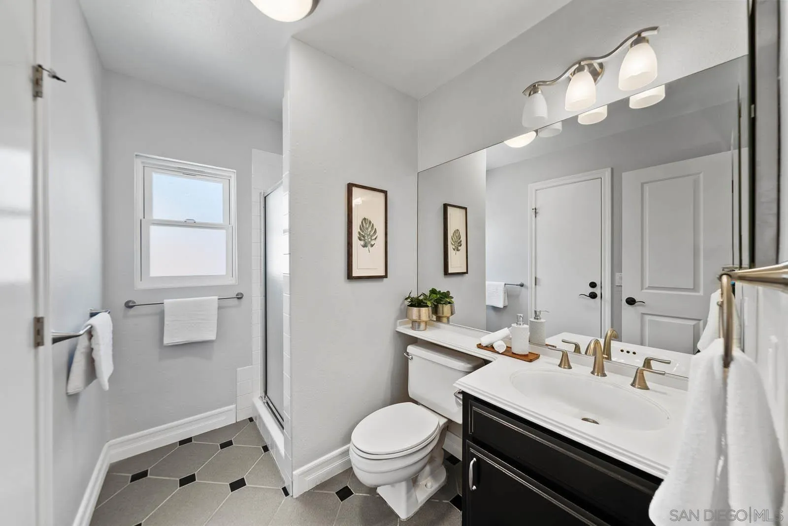 14012 Valley Springs Road Poway, CA 92064 - Photo 33 of 57 a bathroom with a sink toilet and shower