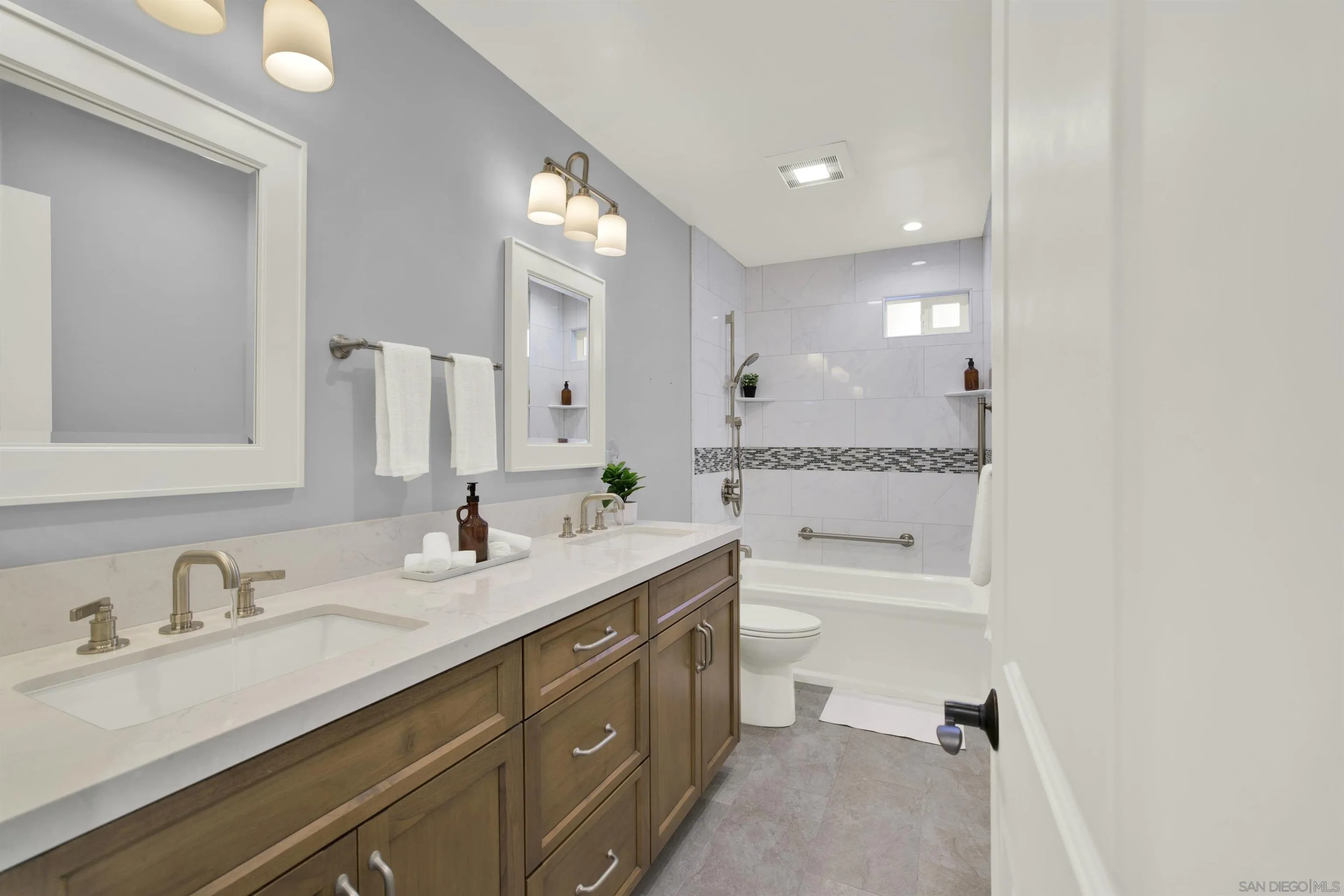 14012 Valley Springs Road Poway, CA 92064 - Photo 35 of 57 a bathroom with a granite countertop sink mirror and double