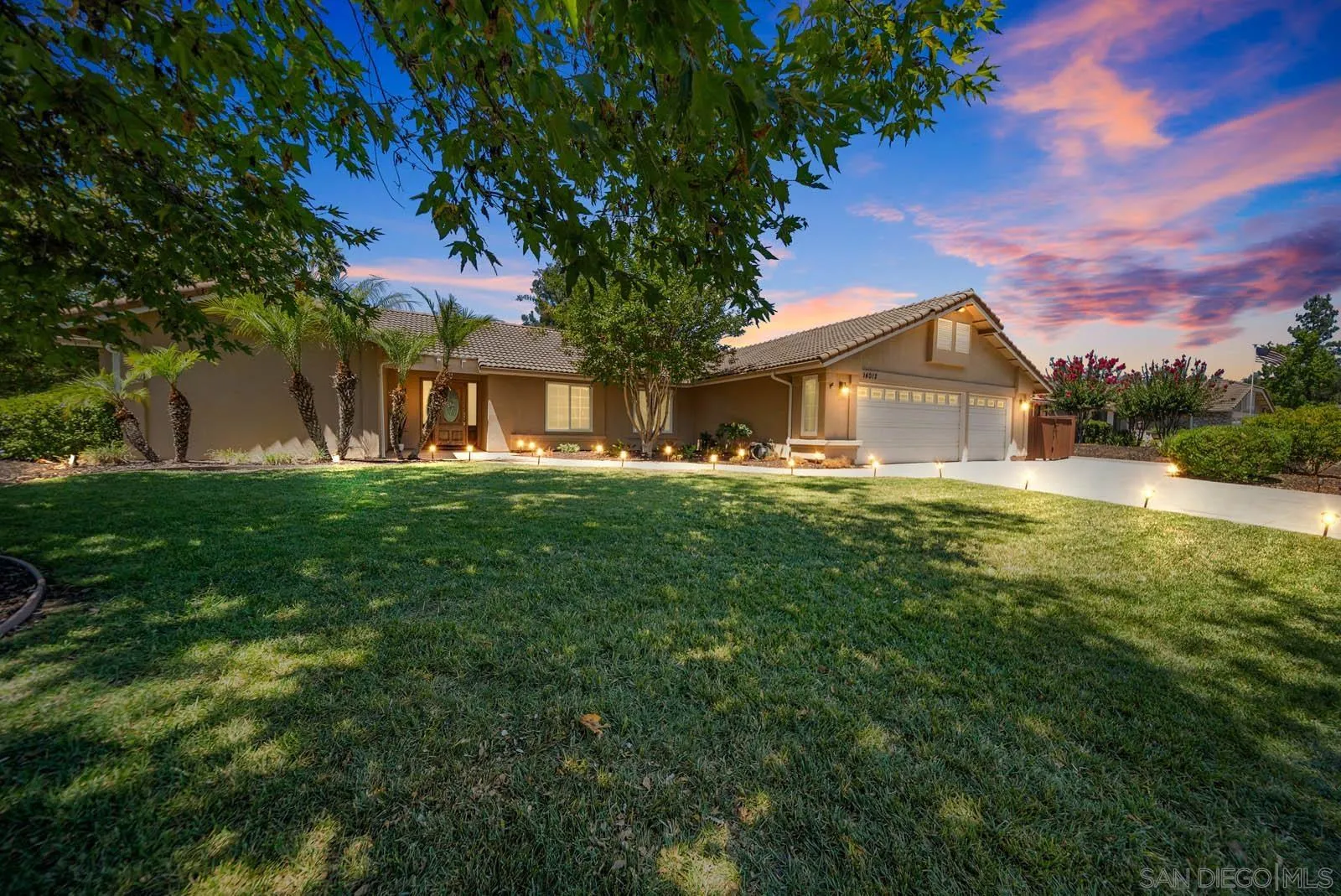 14012 Valley Springs Road Poway, CA 92064 - Photo 7 of 57 a front view of a house with a yard