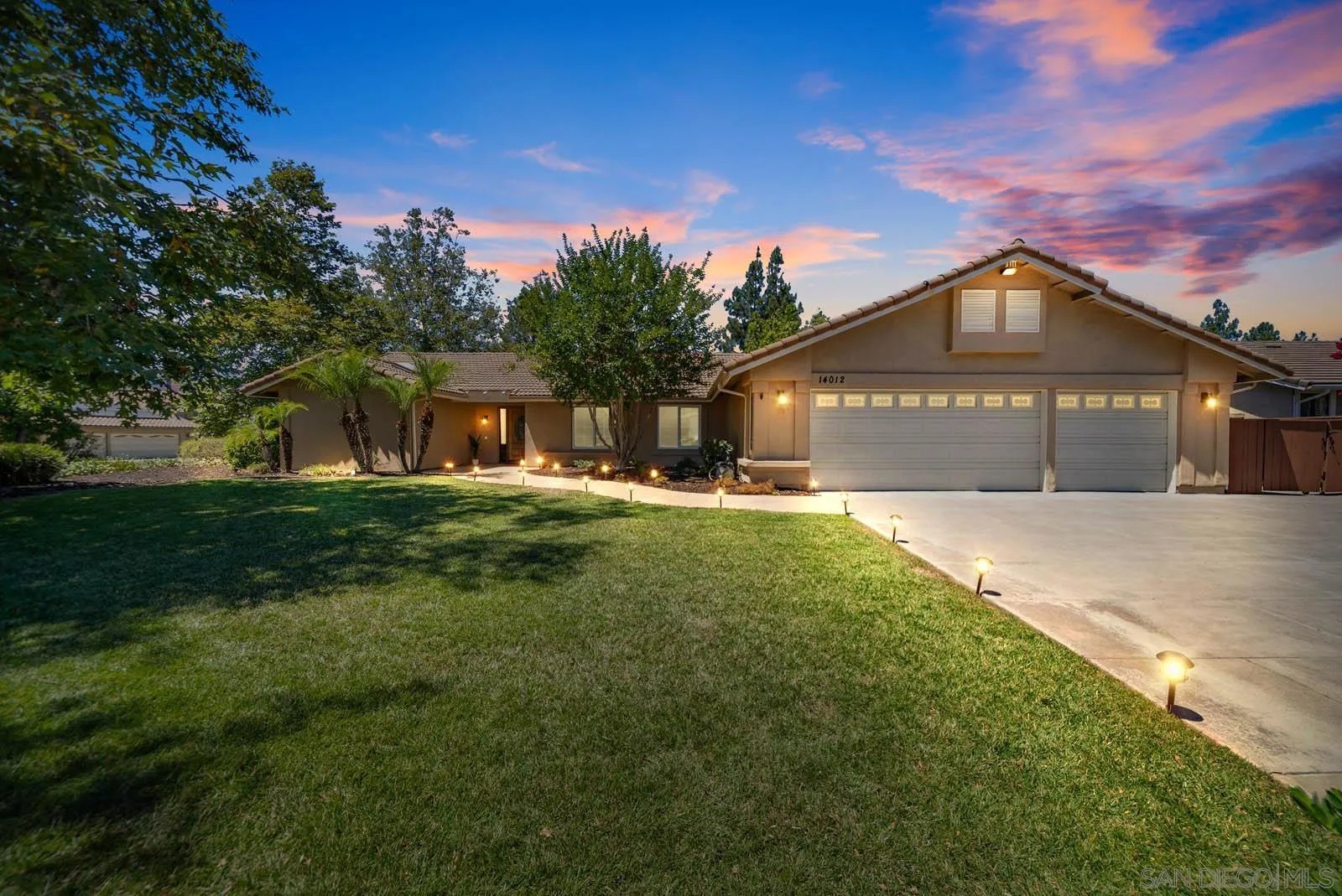 14012 Valley Springs Road Poway, CA 92064 - Photo 8 of 57 a front view of a house with a yard