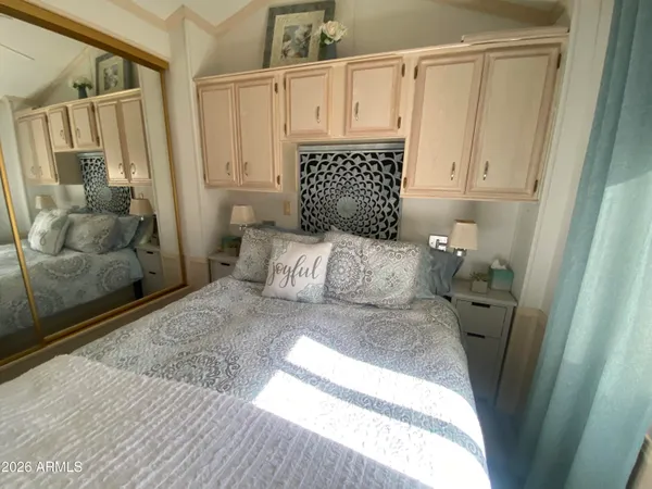 a bedroom with a bed and a window