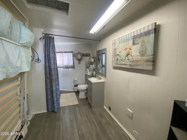 a bathroom with a toilet sink and shower