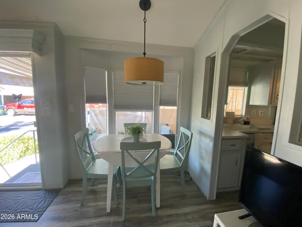 a view of a dining room with furniture window and wooden floor