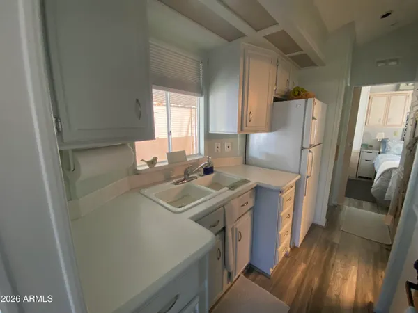 a kitchen with stainless steel appliances a sink stove and refrigerator