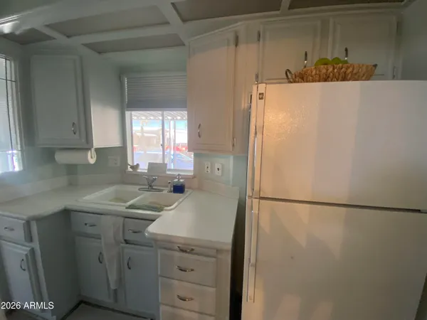 a utility room with cabinets washer and dryer