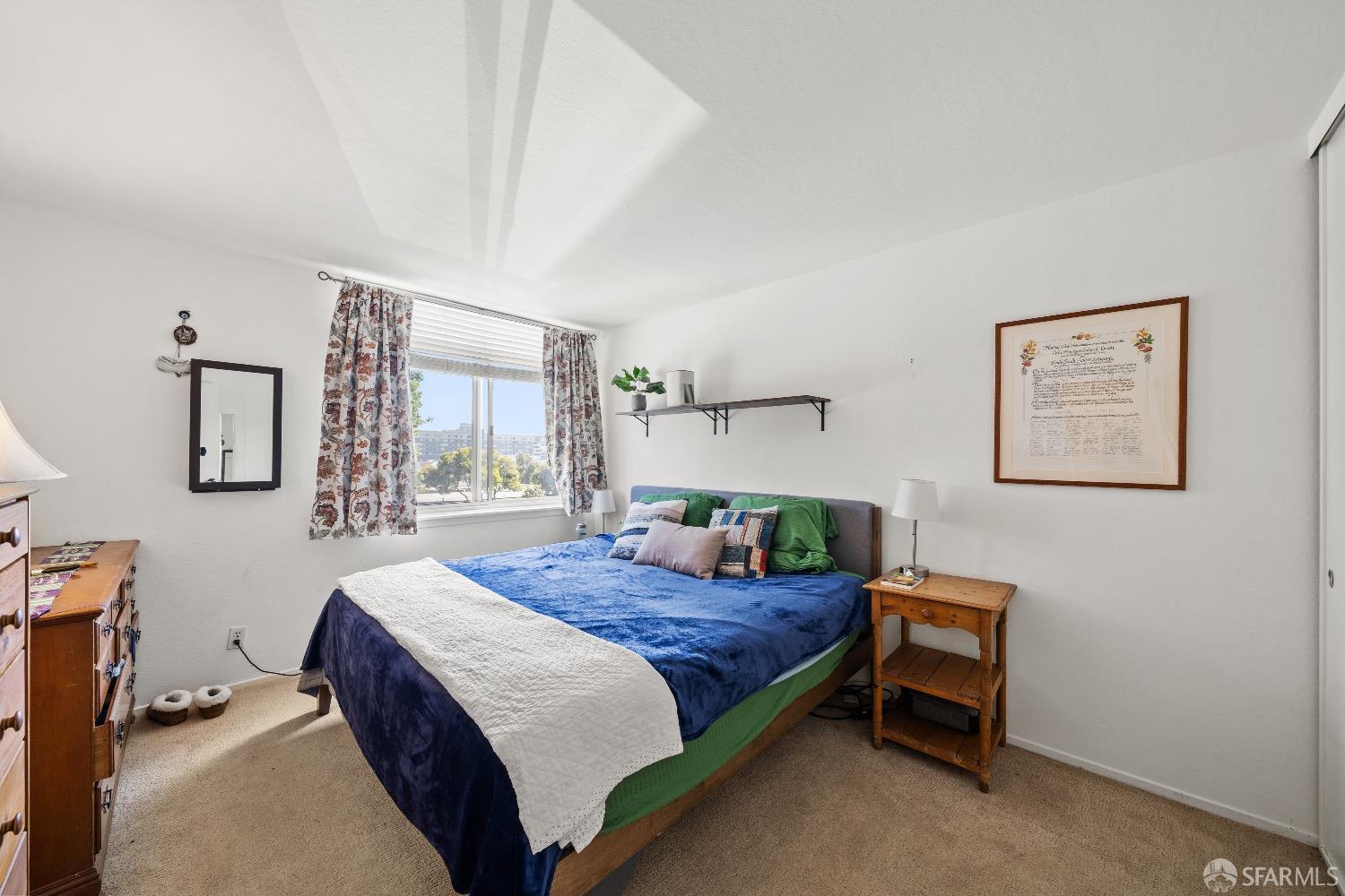 30 Quickstep Lane, Unit 3 San Francisco, CA 94115 - Photo 14 of 20 a bedroom with a bed a table and painting