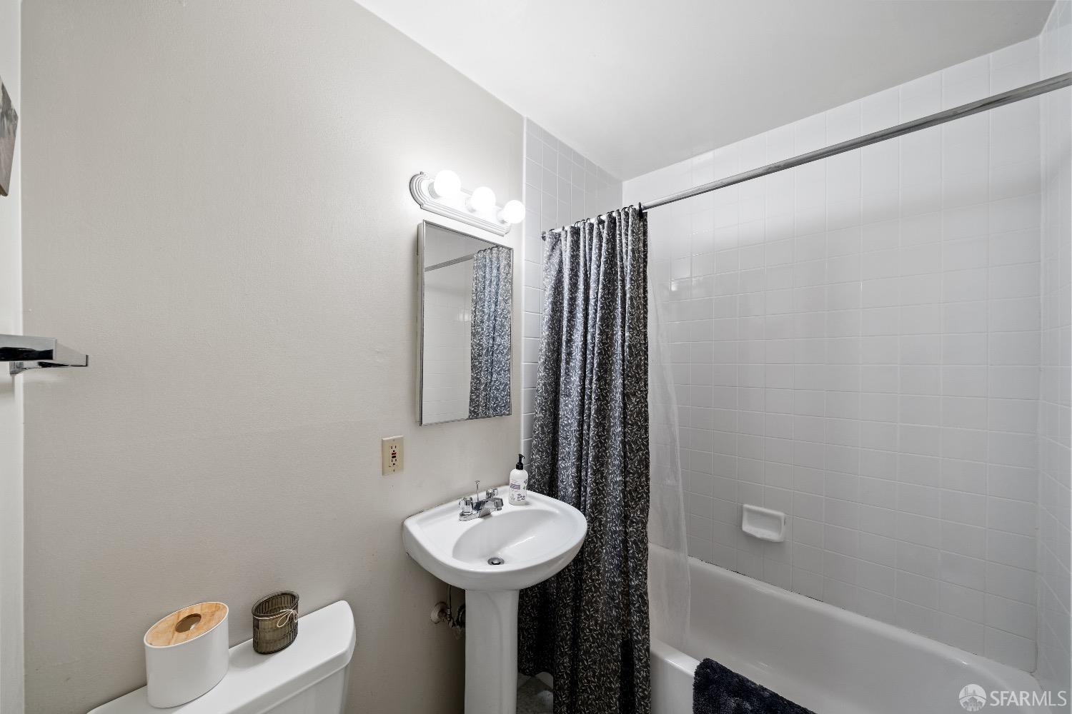 30 Quickstep Lane, Unit 3 San Francisco, CA 94115 - Photo 15 of 20 a bathroom with a sink toilet and shower