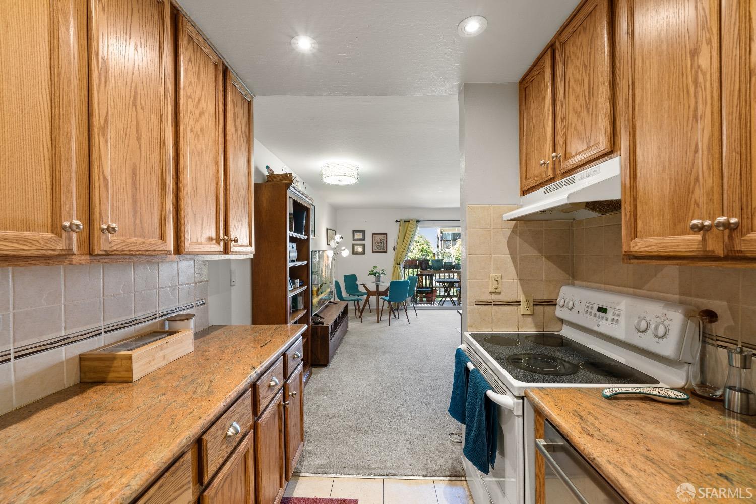 30 Quickstep Lane, Unit 3 San Francisco, CA 94115 - Photo 4 of 20 a kitchen with a stove a sink and a refrigerator