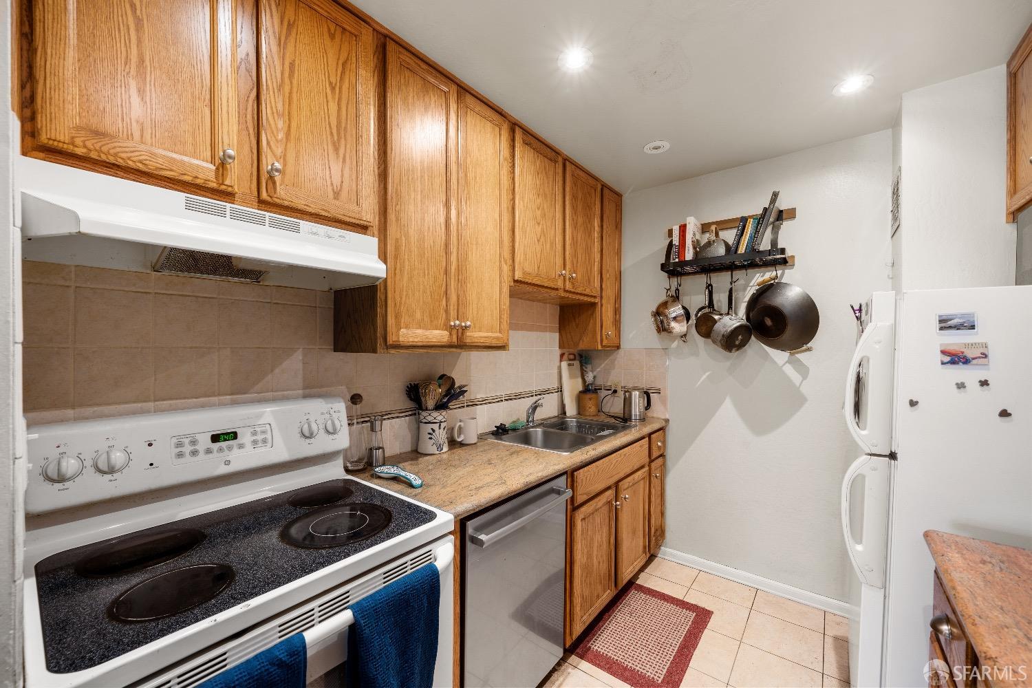 30 Quickstep Lane, Unit 3 San Francisco, CA 94115 - Photo 5 of 20 a kitchen with sink cabinets and appliances