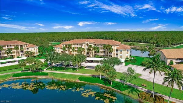a view of a garden with a building in the background