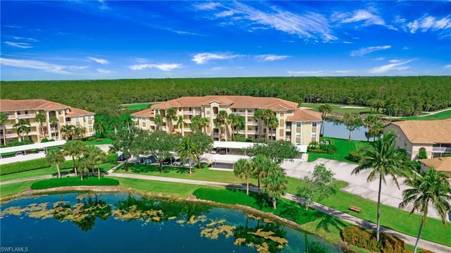 a view of a garden with a building in the background
