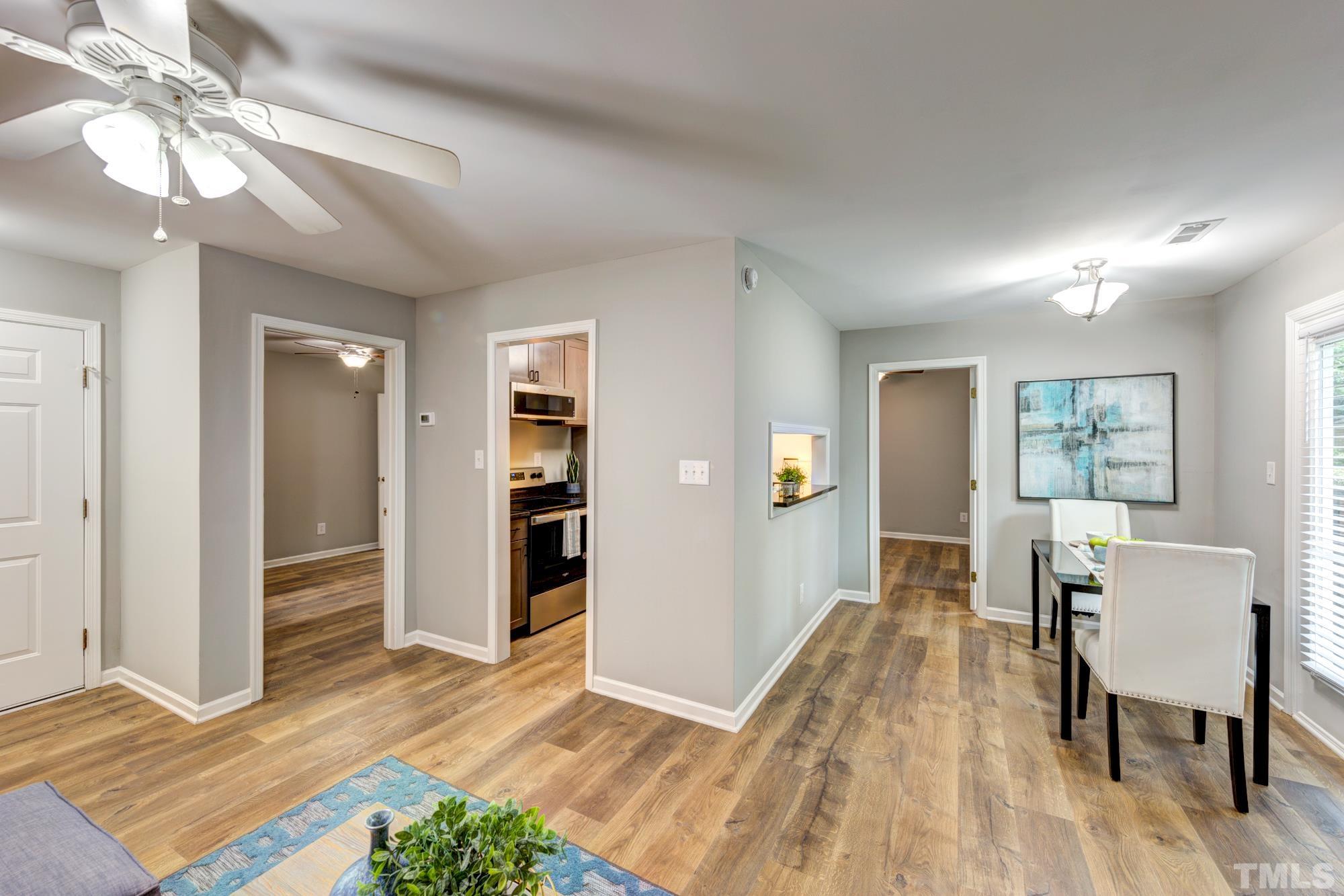 3623 Mill Run, Unit 3623 Raleigh, NC 27612 - Photo 11 of 23 a view of a livingroom with furniture and wooden floor