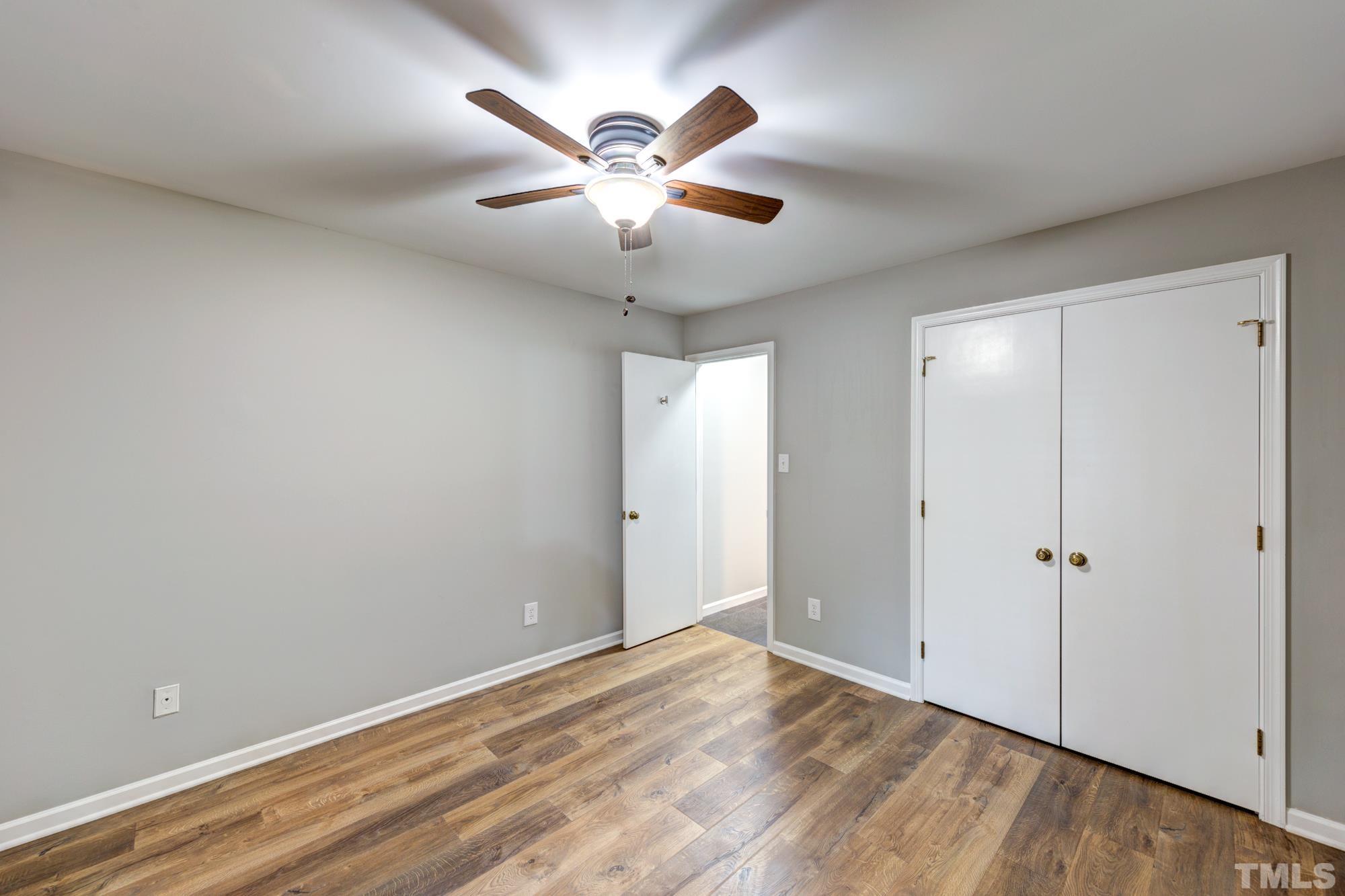 3623 Mill Run, Unit 3623 Raleigh, NC 27612 - Photo 13 of 23 wooden floor in an empty room with a window