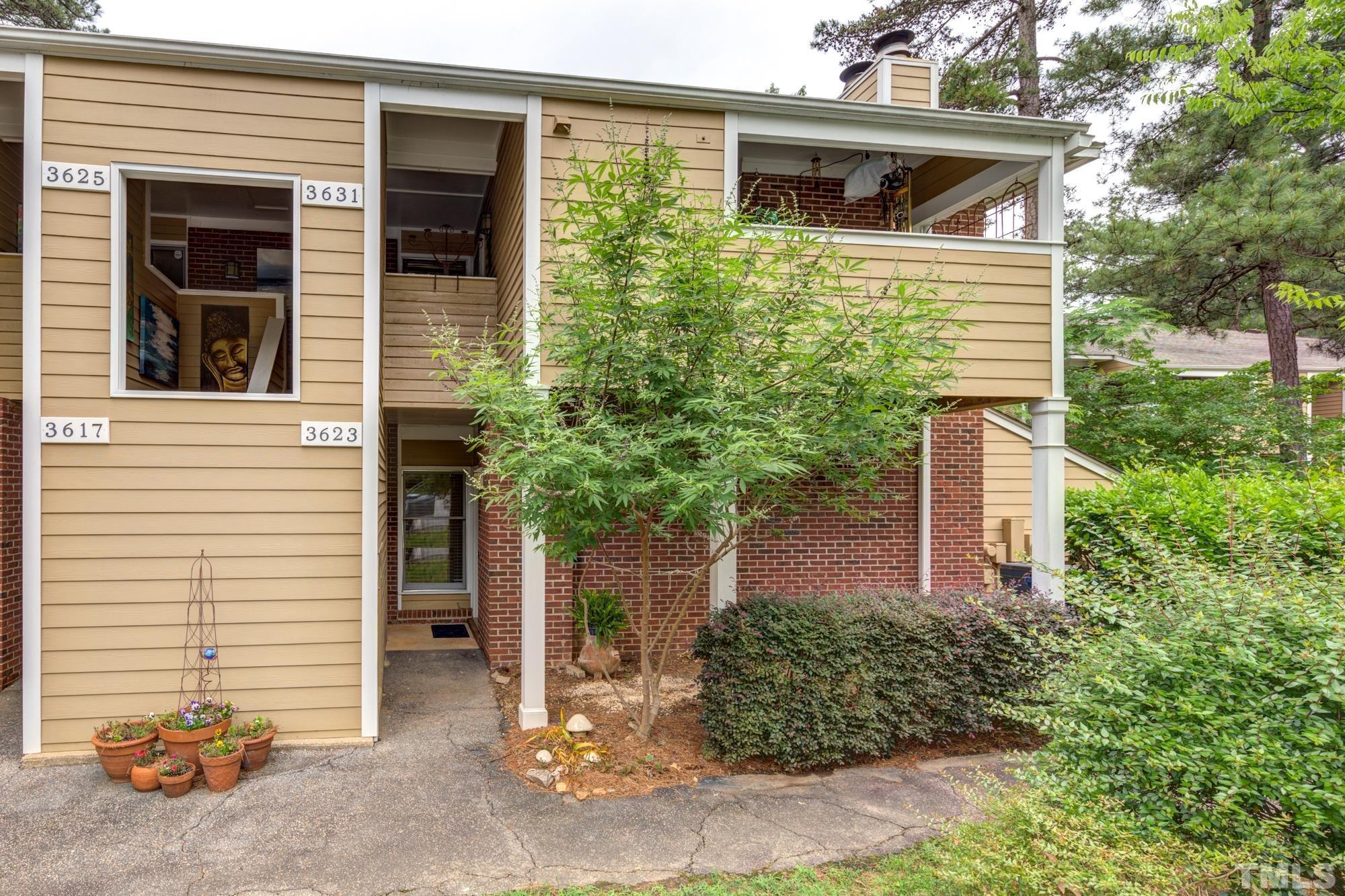 3623 Mill Run, Unit 3623 Raleigh, NC 27612 - Photo 23 of 23 a front view of a house with garden