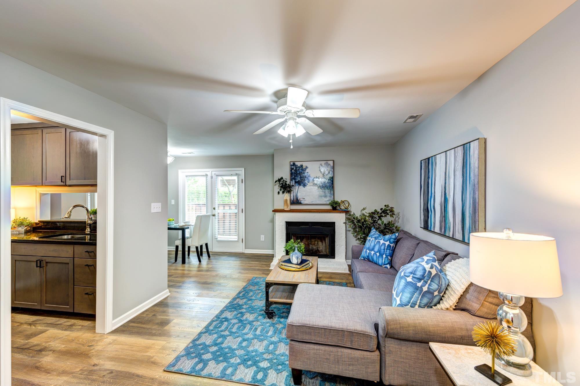 3623 Mill Run, Unit 3623 Raleigh, NC 27612 - Photo 3 of 23 a living room with furniture and a fireplace