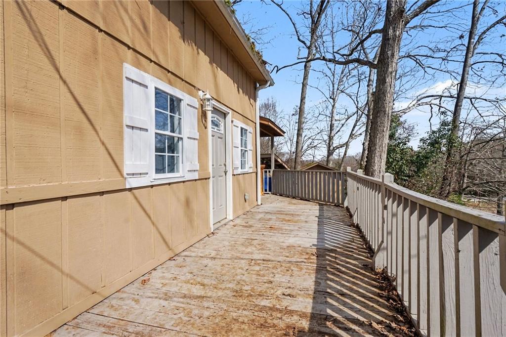 2986 Defore Road Toccoa, GA 30577 - Photo 19 of 19 a view of a balcony with wooden floor and fence and a floor