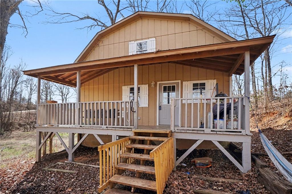 2986 Defore Road Toccoa, GA 30577 - Photo 2 of 19 a view of a house with a yard and deck