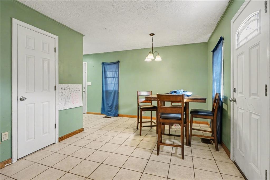 2986 Defore Road Toccoa, GA 30577 - Photo 6 of 19 a view of a dining room with furniture and chandelier