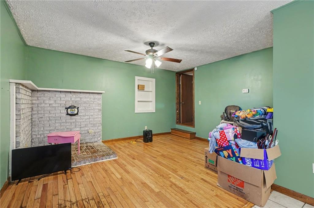 2986 Defore Road Toccoa, GA 30577 - Photo 7 of 19 a bedroom with a bed and a chandelier