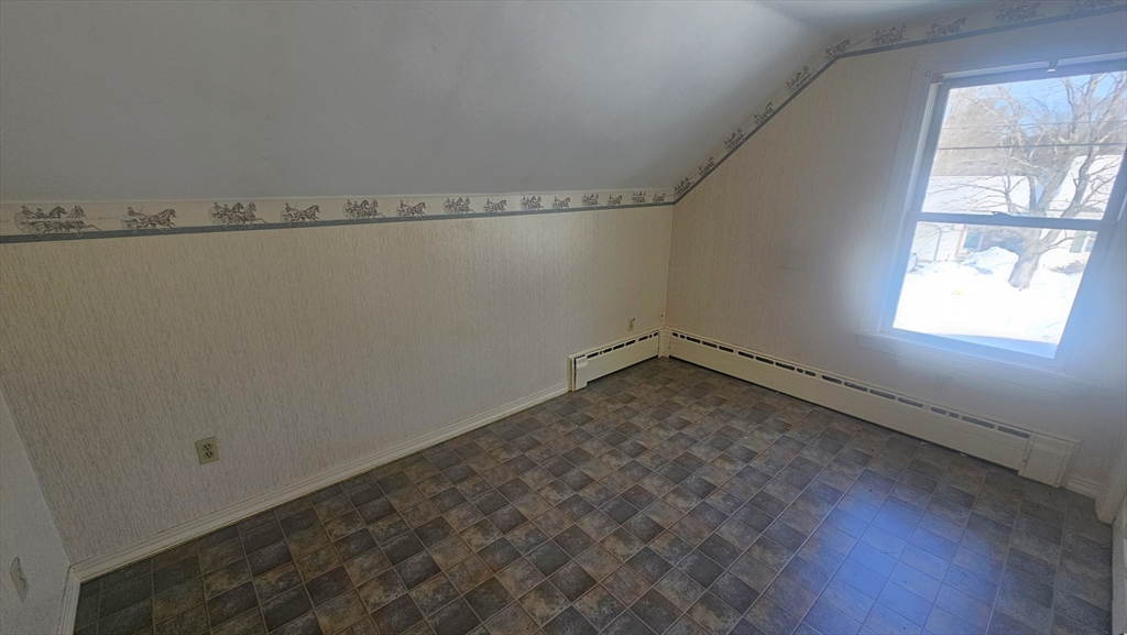 58 Ruggles Street Hardwick, MA 01031 - Photo 17 of 20 a view of a room with rack on the wall and a window