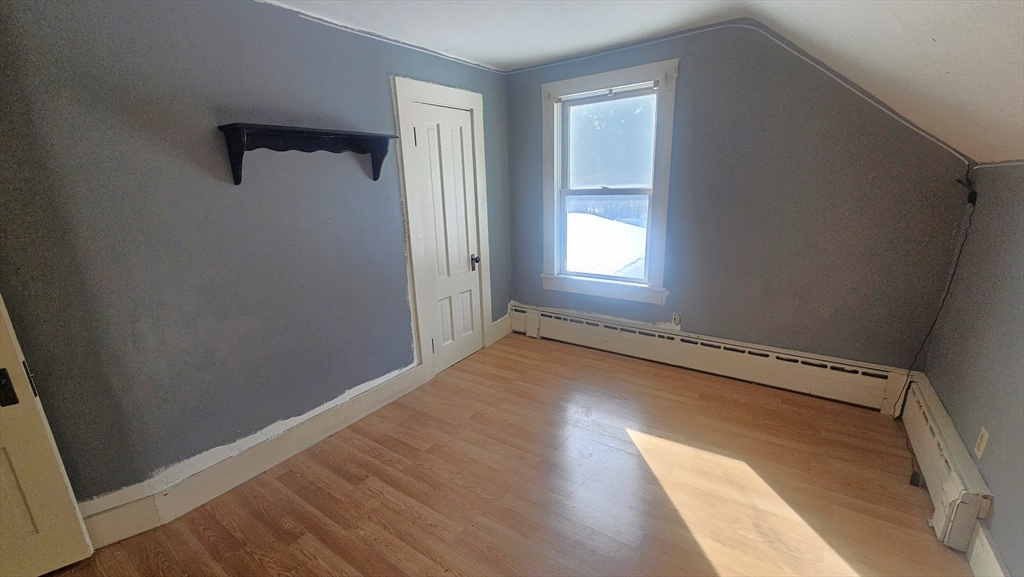 58 Ruggles Street Hardwick, MA 01031 - Photo 19 of 20 a view of a room with wooden floor and windows