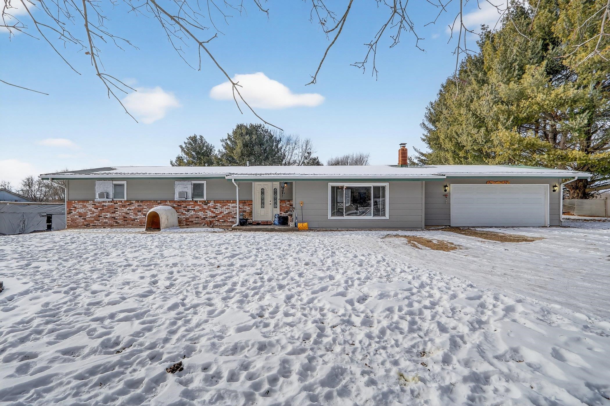 14858 Beaverton Road Poplar Grove, IL 61065 - Photo 45 of 45 a front view of a house with a yard and potted plants