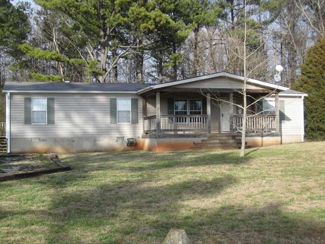 524 Nunn Road Commerce, GA 30529 - Photo 1 of 1 a backyard of a house with yard table and chairs