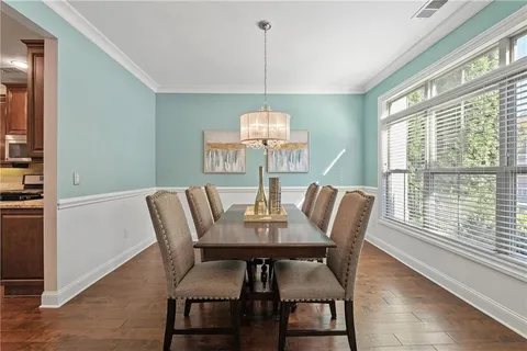 a view of a dining room with furniture window and outside view