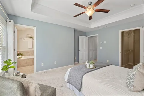 a bathroom with a double vanity sink a mirror and a bathtub