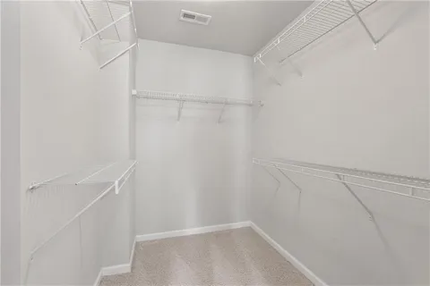 a view of a hallway with closet