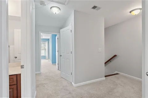 a bathroom with a granite countertop sink a mirror and a bathtub