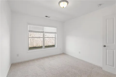 an aerial view of a city with lots of residential buildings