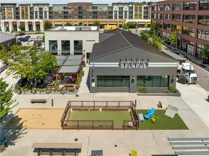 an aerial view of a balcony with chairs