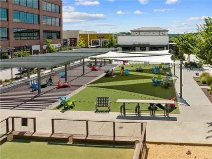 a front view of a house with yard and ocean view