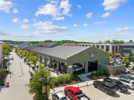 an aerial view of a building with outdoor seating
