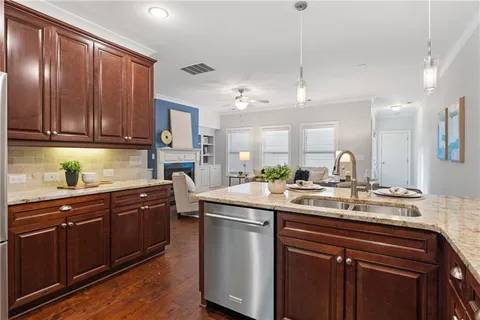 a kitchen with a sink and cabinets