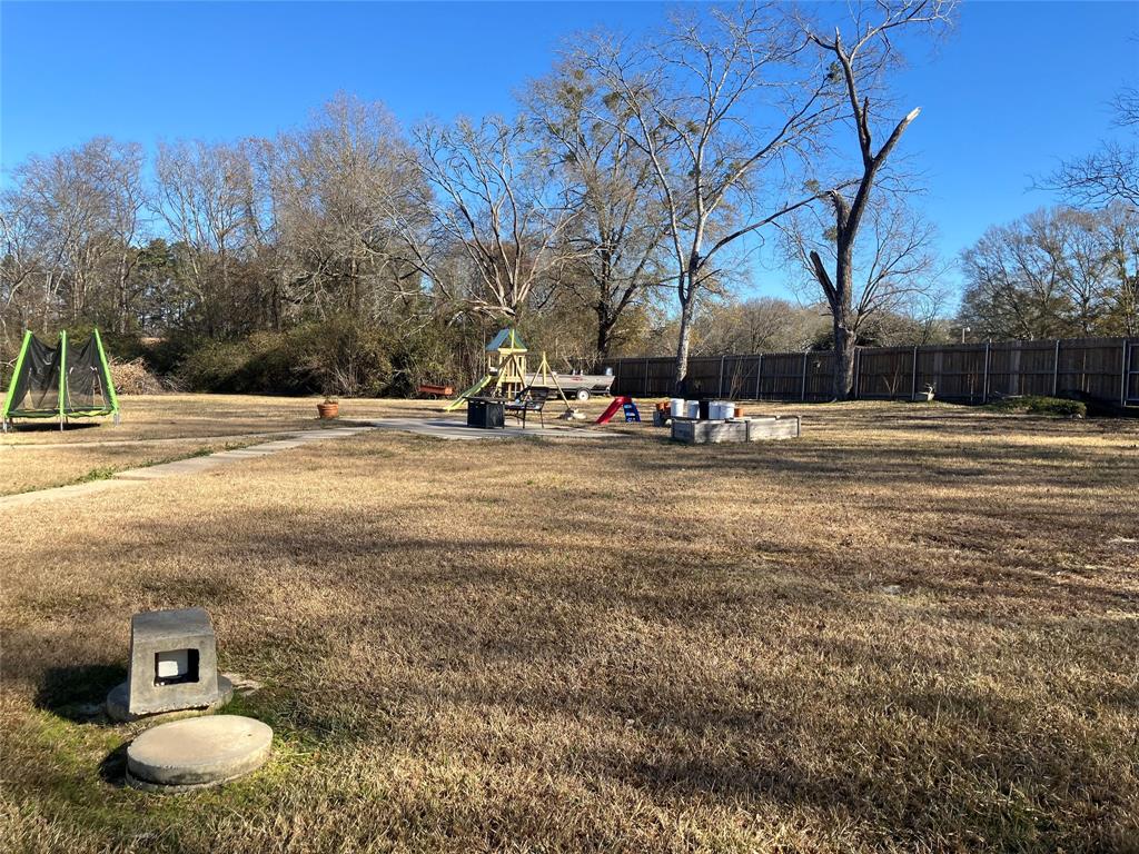 233 Church Road Stonewall, LA 71078 - Photo 3 of 32 View of yard with a playground and a trampoline