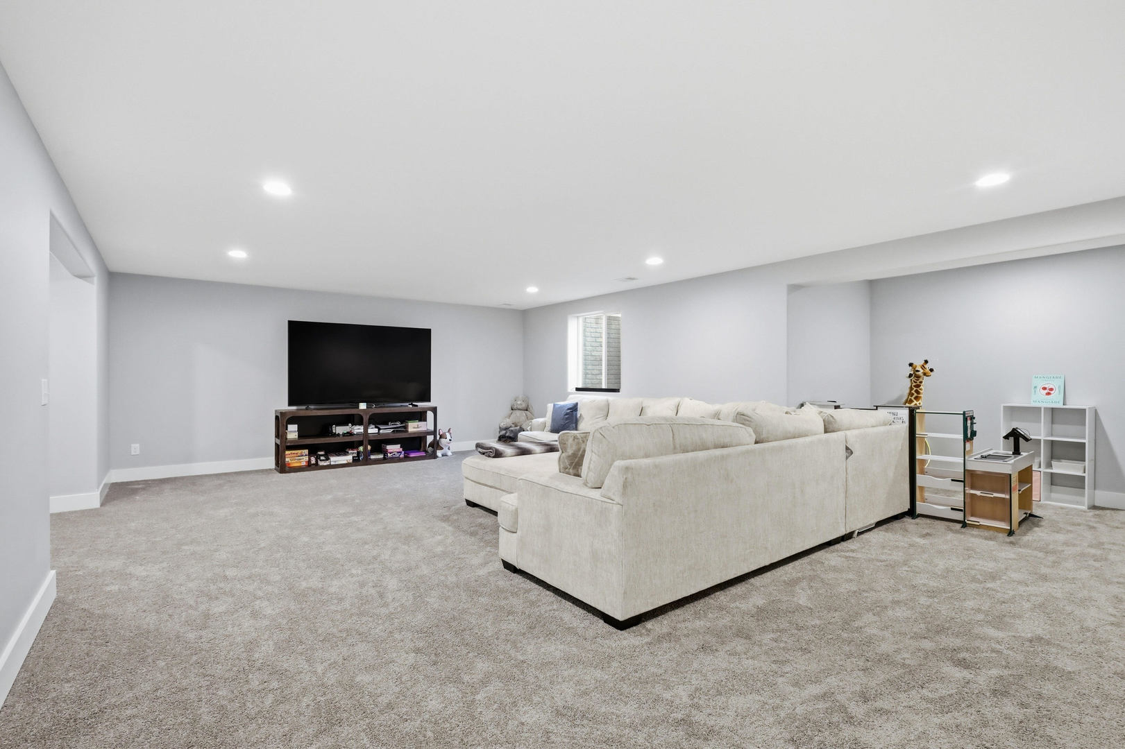 6779 Genesis Way Bettendorf, IA 52722 - Photo 29 of 36 a living room with furniture and a flat screen tv
