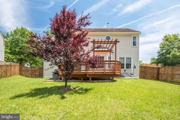 a view of a house with a back yard
