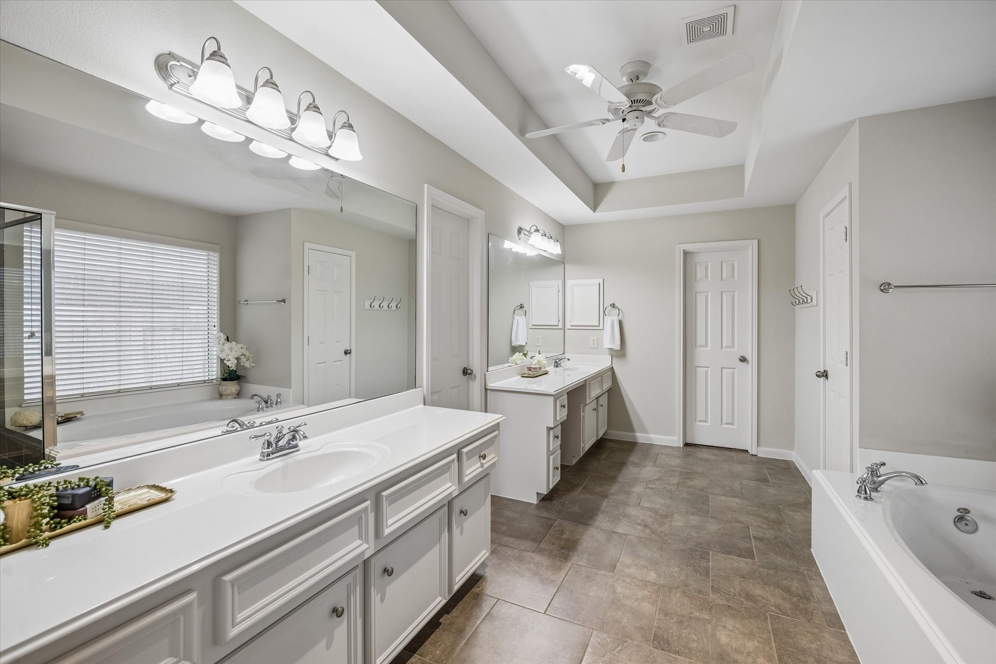 25827 Austin Springs Spring, TX 77373 - Photo 17 of 34 Bright and spacious primary bathroom with access to TWO walk-in his and her closets.