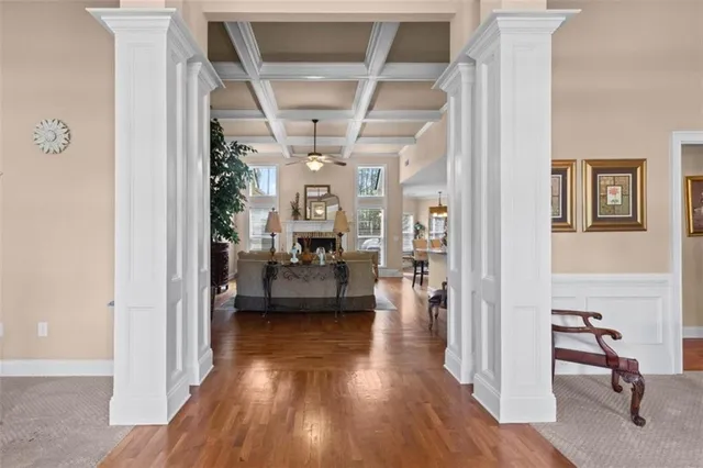 a living room with furniture and a glass door