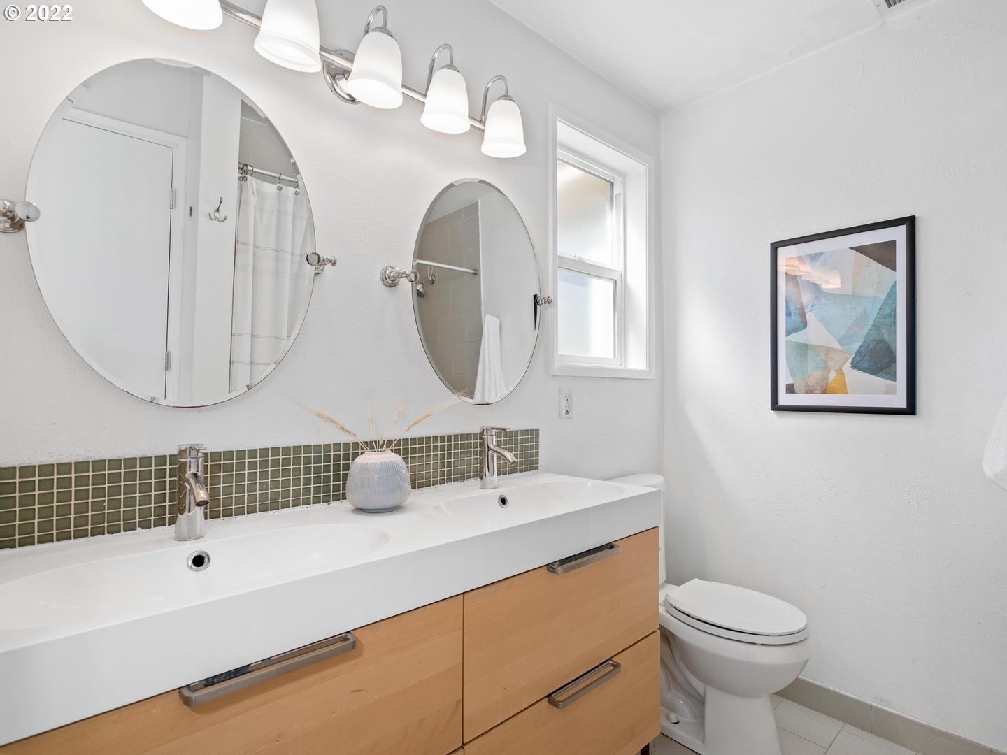 3200 Southeast Loeffelman Road Milwaukie, OR 97222 - Photo 16 of 32 a bathroom with a toilet a sink and a mirror