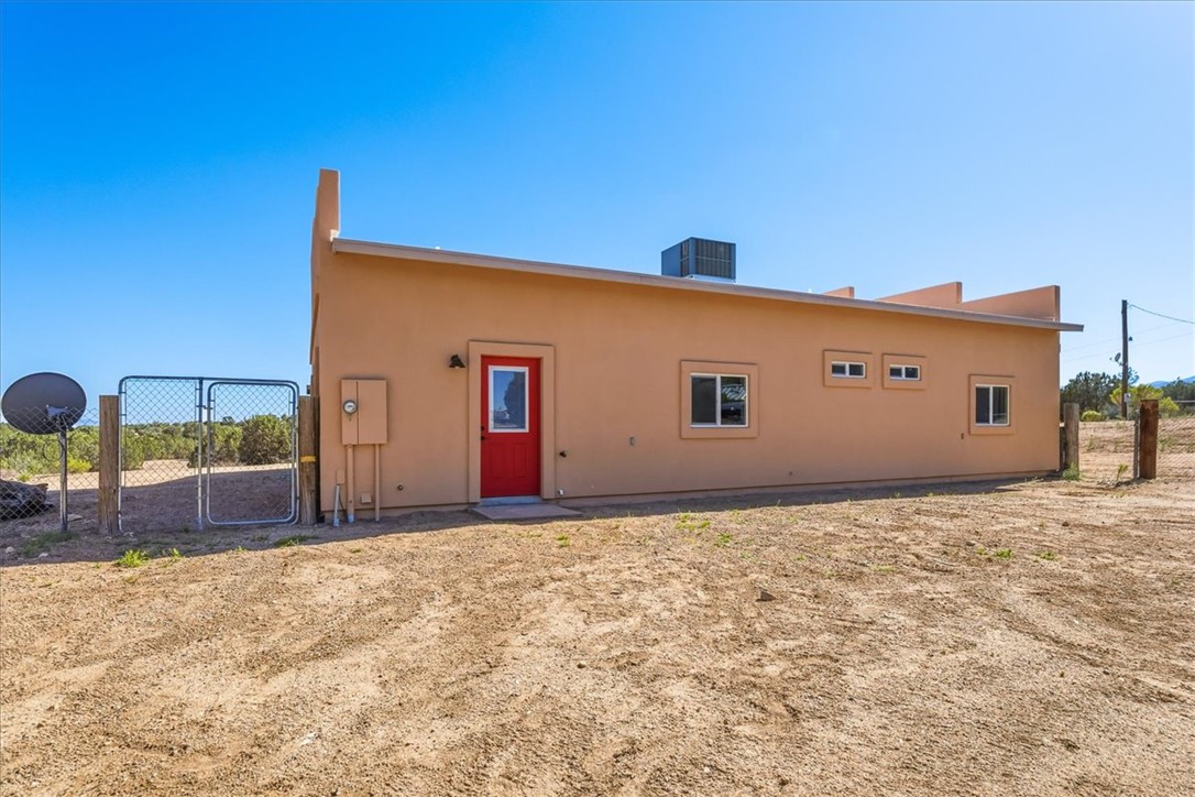 10374 East Happy Trails Road Kingman, AZ 86401 - Photo 47 of 68 a front view of a house with basket ball court