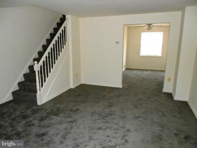 2034 Jasmine Road Dundalk, MD 21222 - Photo 6 of 23 a view of a hallway with staircase